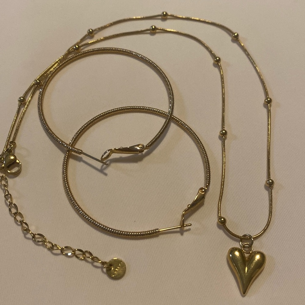 Heart shaped necklace and gold hoop earrings